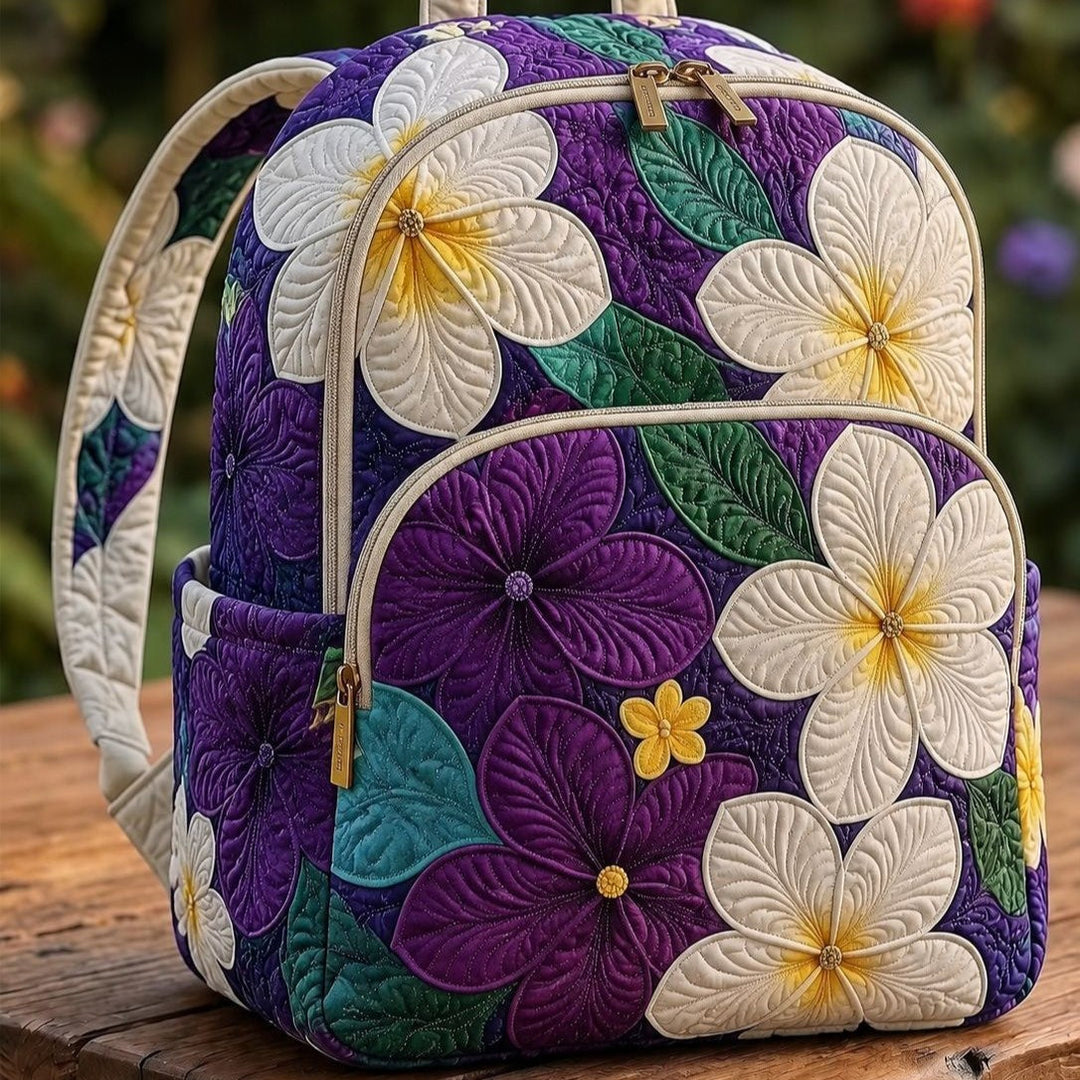 Gesteppter Rucksack – Lila Frangipani von Brigitte Wien
